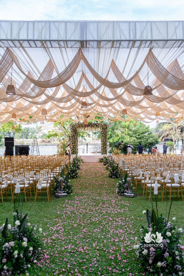 Outdoor wedding arch and floral draping